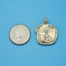Pendant size next to a Quarter