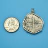 Pendant size next to a Quarter
