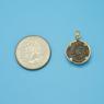 Pendant size next to a Quarter