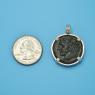 Pendant size next to a Quarter