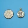Pendant size next to a Quarter