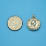 Pendant size next to a Quarter