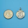 Pendant size next to a Quarter