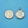 Pendant size next to a Quarter