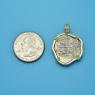 Pendant size next to a Quarter