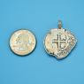 Pendant size next to a Quarter
