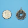 Pendant size next to a Quarter