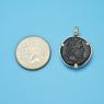 Pendant size next to a Quarter