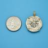 Pendant size next to a Quarter