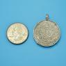 Pendant size next to a Quarter