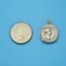 Pendant size next to a Quarter