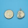 Pendant size next to a Quarter
