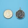 Pendant size next to a Quarter