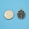 Pendant size next to a Quarter