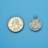 Pendant size next to a Quarter