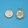 Pendant size next to a Quarter