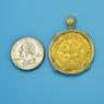 Pendant size next to a Quarter