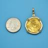 Pendant size next to a Quarter
