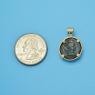 Pendant size next to a Quarter