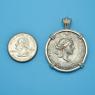 Pendant size next to a Quarter