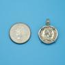 Pendant size next to a Quarter