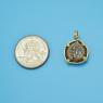 Pendant size next to a Quarter