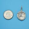 Pendant size next to a Quarter