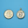 Pendant size next to a Quarter