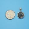 Pendant size next to a Quarter