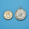 Pendant size next to a Quarter