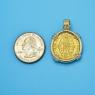 Pendant size next to a Quarter