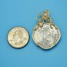 Pendant size next to a Quarter