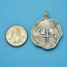 Pendant size next to a Quarter