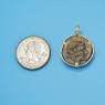 Pendant size next to a Quarter