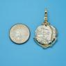 Pendant size next to a Quarter