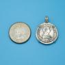 Pendant size next to a Quarter