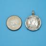 Pendant size next to a Quarter