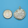 Pendant size next to a Quarter