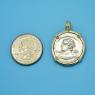 Pendant size next to a Quarter