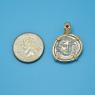 Pendant size next to a Quarter
