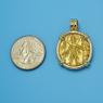 Pendant size next to a Quarter