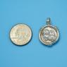 Pendant size next to a Quarter