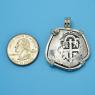 Pendant size next to a Quarter