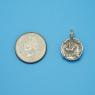 Pendant size next to a Quarter
